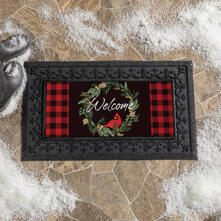 Decorative doormat with red plaid patterns and 'Welcome' text 