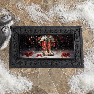 Decorative doormat with red cowboy boots and bows on a black border.