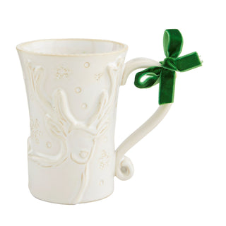 White mug with embossed reindeer design and green ribbon on a white background