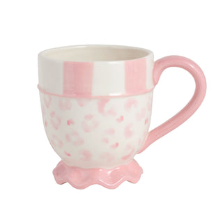 Pink and white leopard print ceramic mug with a decorative 