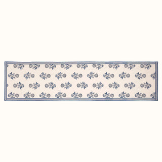 Long rectangular table runner with blue floral pattern on a white background