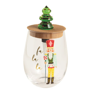 Clear glass tumbler with nutcracker design and Christmas tree lid 