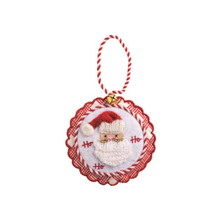 Decorative Christmas ornament with a knitted Santa Claus face on a white background