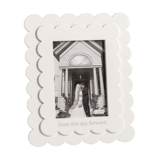 White scalloped photo frame with a black and white photo of a couple and 'from this day forward' text.