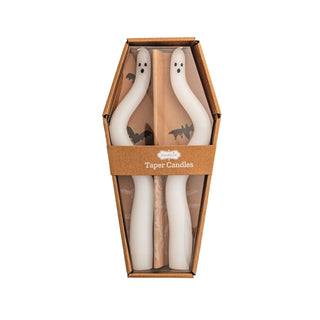 Two ghost-shaped candles in a decorative coffin-shaped box