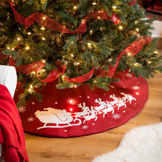 Red tree skirt with Sants's sleigh