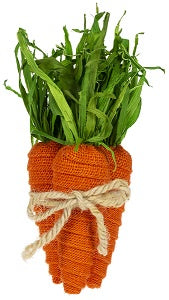 Decorative carrots made of fabric with green stems on a whitebackground