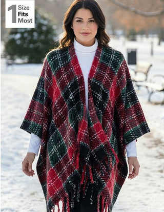  red holiday plaid wrap poncho, showing a woman modeling the wrap in a snowy outdoor setting,
