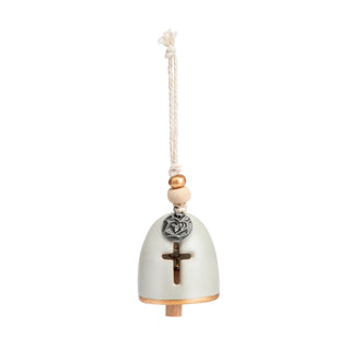 Decorative bell with cross and beads on a white background