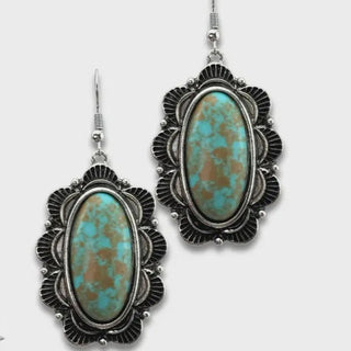 Turquoise stone earrings with silver detailing 