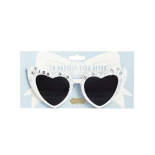 Heart-shaped sunglasses with white frame and black lenses on a light blue background
