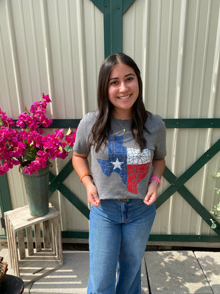 Experience the ultimate American road trip in style with our Texas Flag Roadtrip shirt. Crafted in heather gray, this exclusive design embodies the free-spirited essence of Texas.