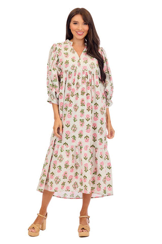 Woman wearing a floral midi dress on a white background