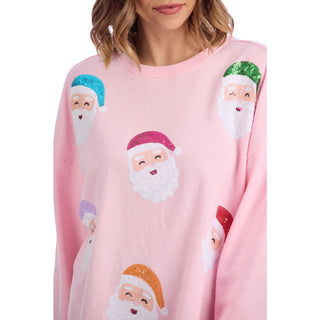 Pink sweater with sequin Santa Claus faces
