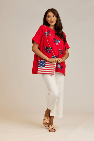 Americana Beaded Clutch

Show off your patriotic spirit with this striking hand-beaded clutch, designed with a vibrant American flag motif.