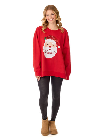 An adult's oversized red crewneck sweatshirt featuring a smiling Santa Claus graphic with a sequined hat and a beard that reads "Falala."