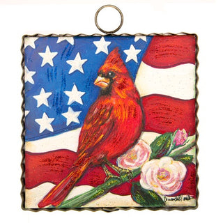 Round Top Charm with a red cardinal bird, American flag, and flowers 
