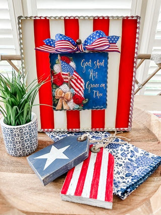 Decorative items with American flag theme on a wooden surface