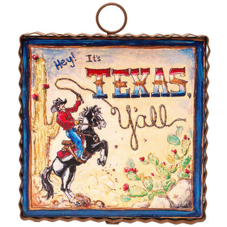 Decorative sign with cowboy and horse illustration and 'It's Texas Y'all' text.