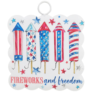 Decorative card with colorful firework designs and text 'Fireworks and freedom' on a white background.
