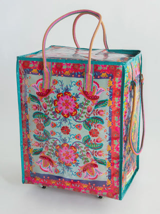 Colorful floral-patterned bag with handles on a white background