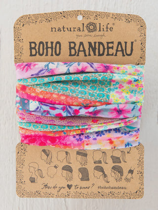 A Natural Life "Boho Bandeau" showcasing a vibrant, multicolored floral patchwork pattern in bright pink, orange, and teal. 
