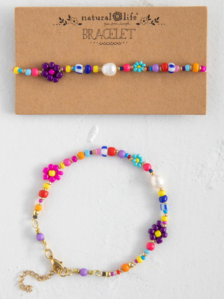 Colorful beaded bracelet on a white background with 'natural life' branding.
