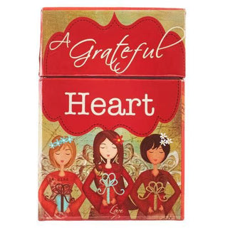 Card game box titled 'A Grateful Heart' with illustrations of three women on a red and gold background.