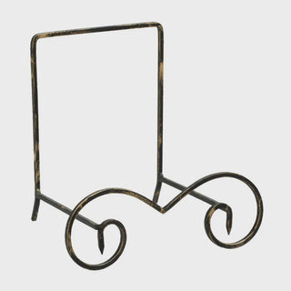 Decorative metal stand with a curved design on a white background