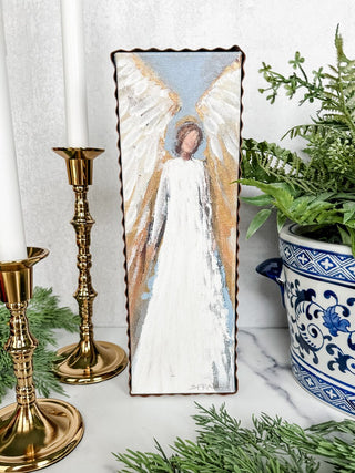 Framed decorative angel wall art with gold accents