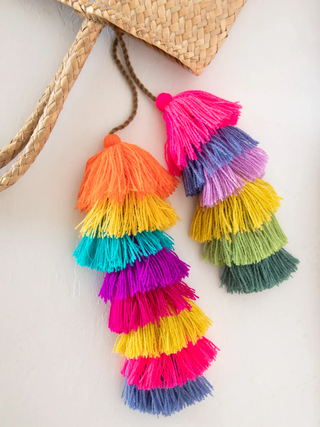 Colorful tassel that is used to hang around your rear view mirror in a car.