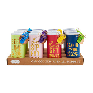 Six colorful can coolers with lid poppers displayed in a brown cardboard tray on a white background. The can coolers are lime green, light pink, red, and navy blue, each with gold lettering and a small colorful tag tied with twine.