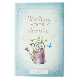 A book cover titled 'Walking with the Savior' by Max Lucado, featuring a watercolor design of a watering can with flowers and a butterfly on a light blue background.