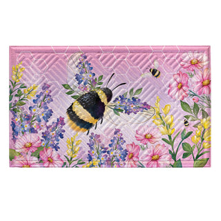 Doormat with bee and floral design on a pink background