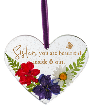 Heart-shaped ornament with flowers and text 'Sister, you are beautiful inside & out.'