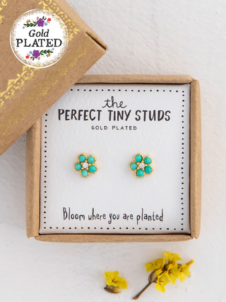 Gold-plated flower-shaped earrings in a box with 'Gold Plated' label.