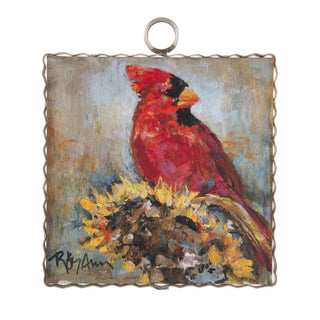 Round Top Charm of a red cardinal bird on a textured background