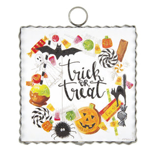 Halloween themed charm with "trick or treat" wreath