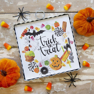 Halloween themed charm with "trick or treat" wreath