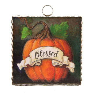 Fall themed charm with a pumpkin and banner that says "Blessed"