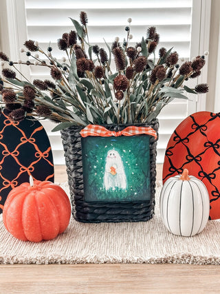 Halloween charm with ghost holding candy corn