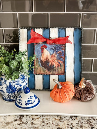 Charm with painting of a rooster using vibrant colors