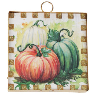 Colorful pumpkins on a checkered background
