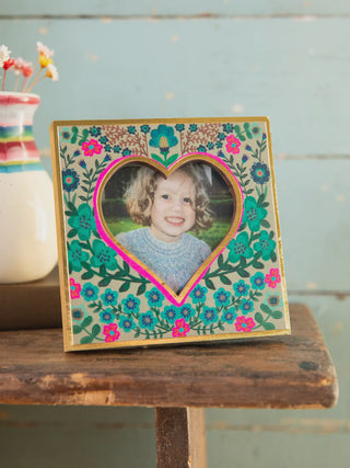 Heart-shaped photo frame with floral design 