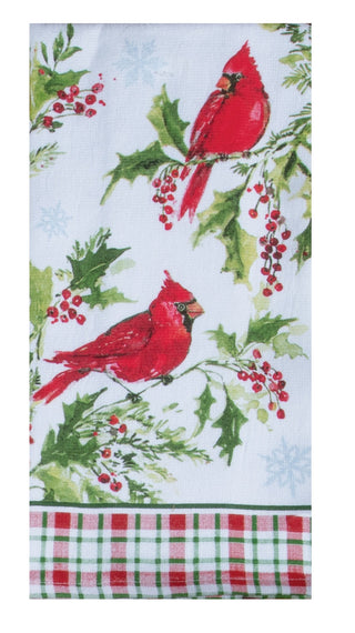 Kitchen towel with red cardinals, holly leaves, and berries on a white background