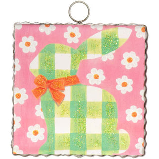 Round Top Charm square with a green checkered pattern, orange bow, and white flowers on a pink background.