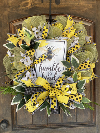 Decorative wreath with bees and 'humble & kind' text