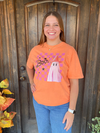 Orange T-shirt with a ghost on top of a checkered print and "Boo"