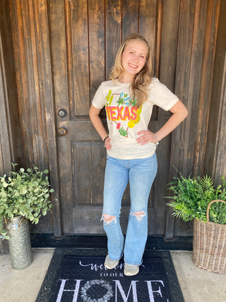 Show off your Texas pride in colorful style with Isabel's Texas Tee! This fun, hand-painted inspired graphic features the iconic shape of Texas filled with vibrant desert blooms, blooming cactus, bluebonnets, and colorful wildflowers, all surrounding a bold "TEXAS" design that celebrates everything we love about the Lone Star State.