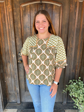Sage green patterned blouse with puff sleeves